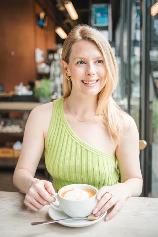Madison Potter at a cafe discussing email marketing strategy over coffee